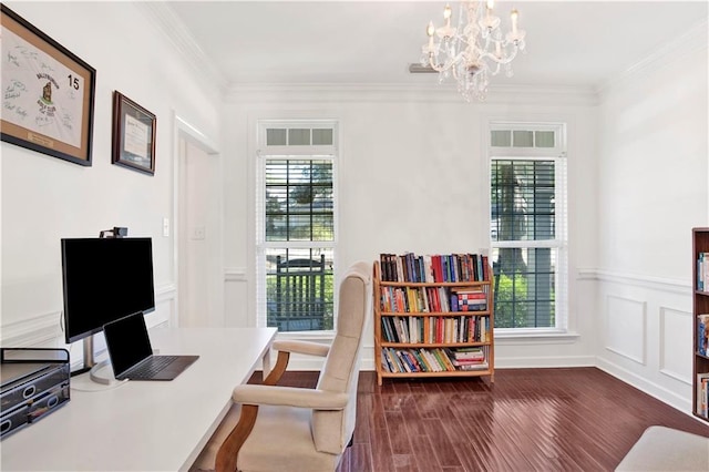 office featuring a chandelier, dark wood-type flooring, a healthy amount of sunlight, and ornamental molding