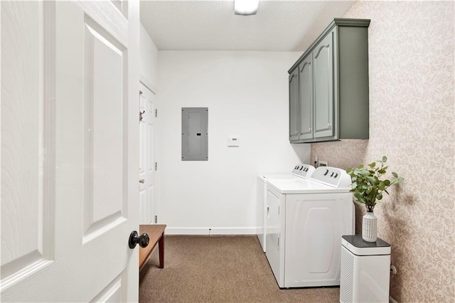 washroom featuring washer and dryer, electric panel, cabinets, and light colored carpet