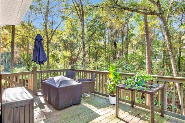 wooden deck featuring area for grilling