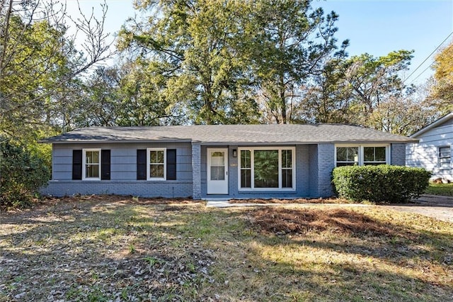 ranch-style home with a front yard