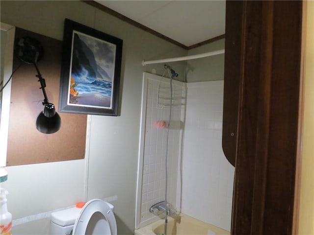 bathroom with ornamental molding and toilet