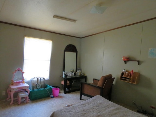 bedroom with carpet flooring and crown molding