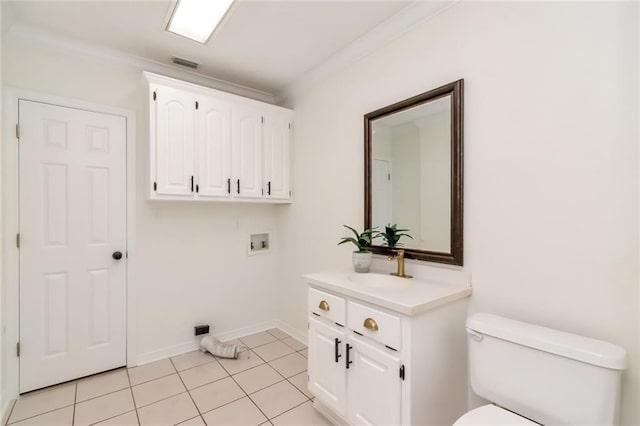 laundry area with washer hookup, light tile patterned floors, ornamental molding, and sink