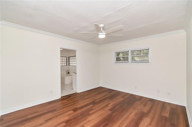 spare room featuring ceiling fan, crown molding, a textured ceiling, and hardwood / wood-style flooring