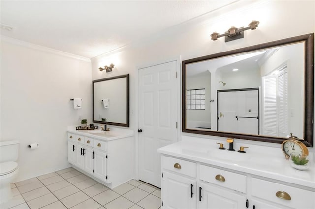 bathroom featuring tile patterned flooring, crown molding, toilet, a shower with door, and vanity