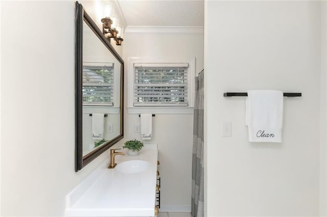 bathroom with an inviting chandelier, a shower with curtain, a textured ceiling, vanity, and ornamental molding