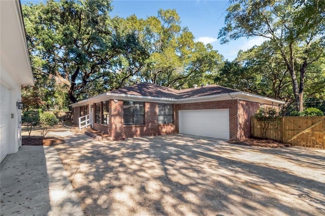 ranch-style home featuring a garage