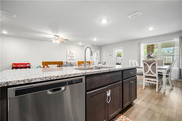 kitchen featuring light hardwood / wood-style floors, pool table, a kitchen island with sink, stainless steel dishwasher, and sink