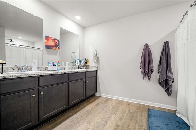 bathroom featuring hardwood / wood-style floors and vanity