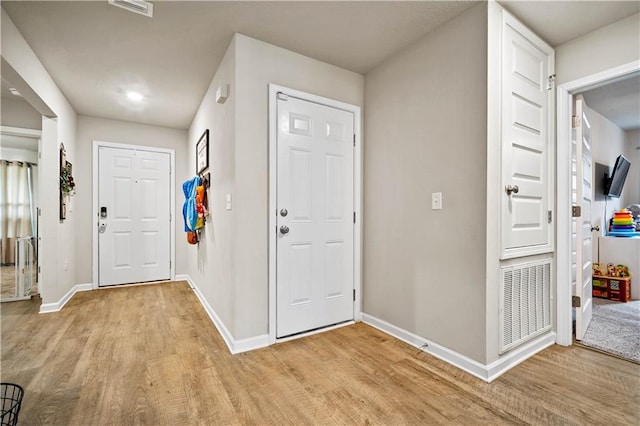 entrance foyer with light hardwood / wood-style flooring