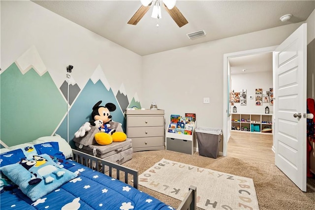 bedroom featuring ceiling fan and carpet