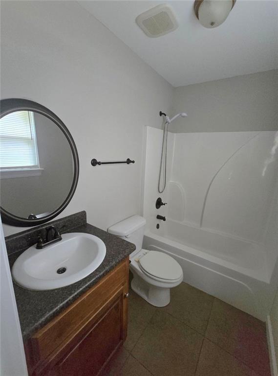 4973 Mccrary Rd, Semmes, AL 36575 - bathroom featuring tub / shower combination, vanity, and tile patterned flooring