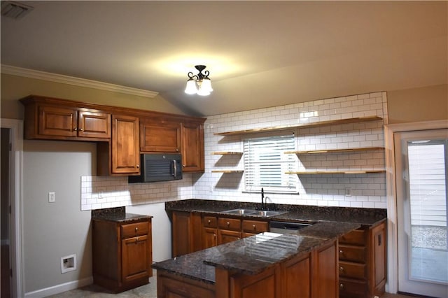 4973 Mccrary Rd, Semmes, AL 36575 - kitchen featuring black microwave, open shelves, brown cabinets, decorative backsplash, and dark stone counters