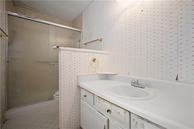 2301 Cedar Ky, Mobile, AL 36695 - bathroom featuring a shower stall, tile patterned flooring, wallpapered walls, and vanity