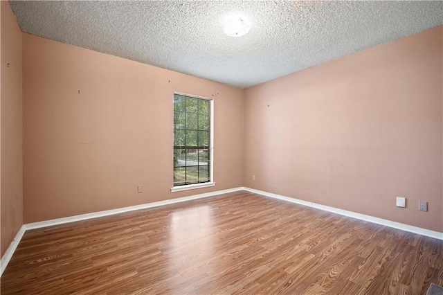 2301 Cedar Ky, Mobile, AL 36695 - spare room with wood finished floors and a textured ceiling