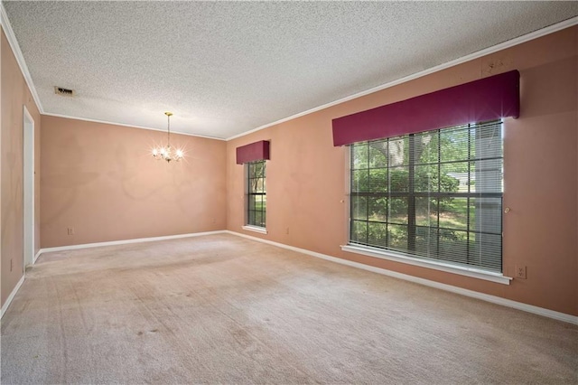 2301 Cedar Ky, Mobile, AL 36695 - carpeted spare room with ornamental molding, a chandelier, and a textured ceiling