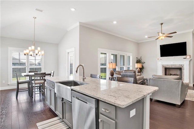 kitchen with pendant lighting, gray cabinetry, dishwasher, and a healthy amount of sunlight