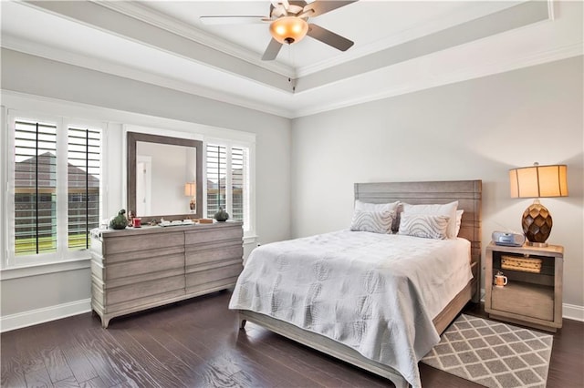 bedroom featuring multiple windows, dark hardwood / wood-style flooring, and ceiling fan