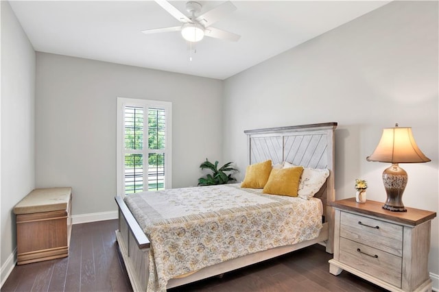 bedroom with ceiling fan and dark wood-type flooring