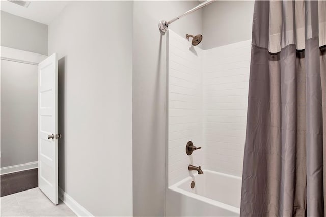 bathroom featuring tile patterned floors and shower / bath combo