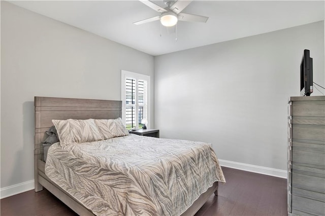 bedroom with ceiling fan and dark hardwood / wood-style flooring