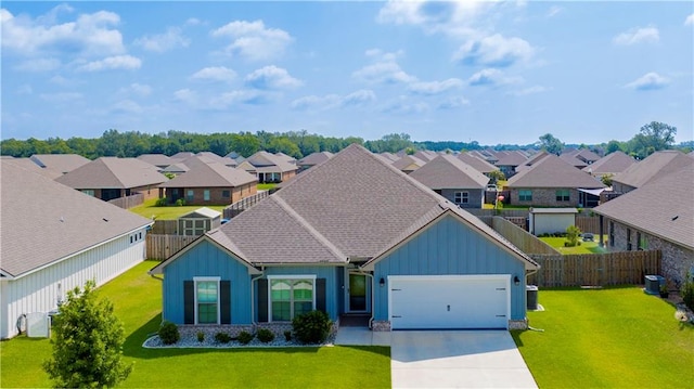 view of front of property with a front yard and a garage