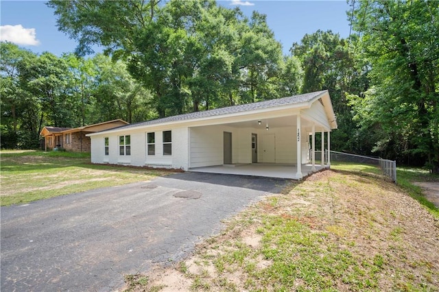 1452 Morlee Dr E, Mobile, AL 36618 - single story home featuring brick siding, asphalt driveway, a carport, and view of scattered trees