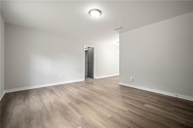 1452 Morlee Dr E, Mobile, AL 36618 - unfurnished room with wood finished floors and baseboards