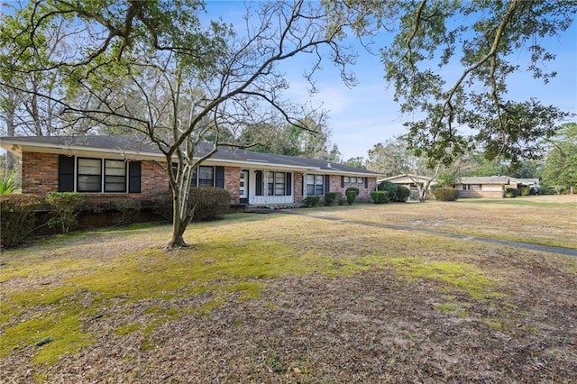 ranch-style home with a front lawn