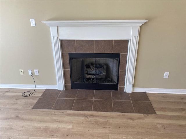 room details featuring wood-type flooring and a fireplace