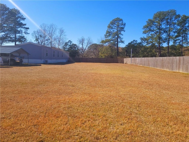 view of yard with a carport