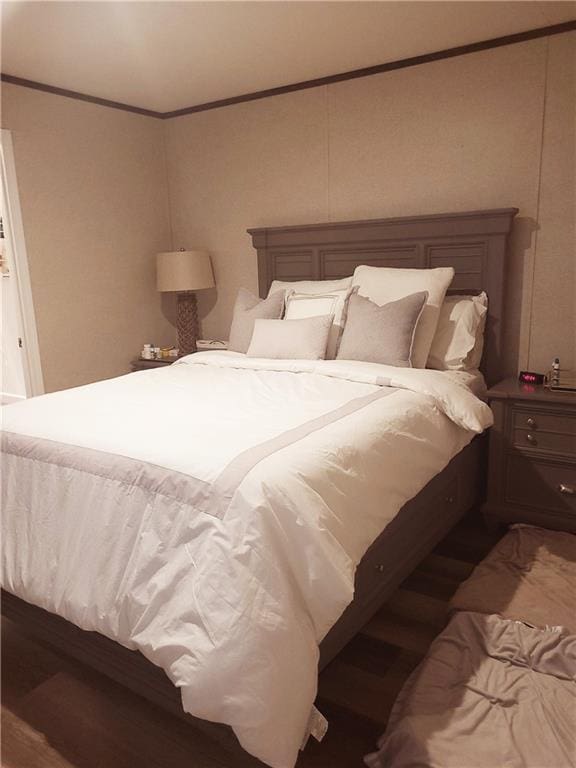 bedroom featuring dark hardwood / wood-style flooring