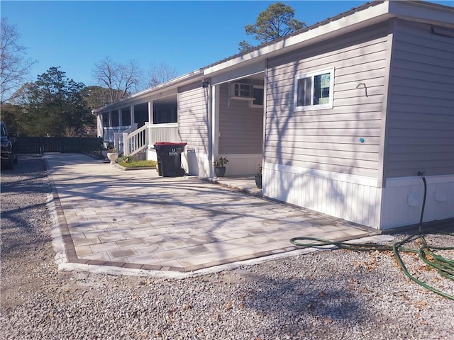 view of side of home featuring a patio