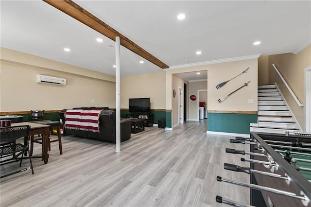 interior space featuring a wall mounted AC, light hardwood / wood-style flooring, and ornamental molding