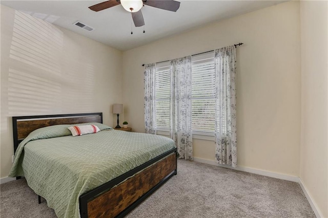 bedroom featuring ceiling fan and light colored carpet