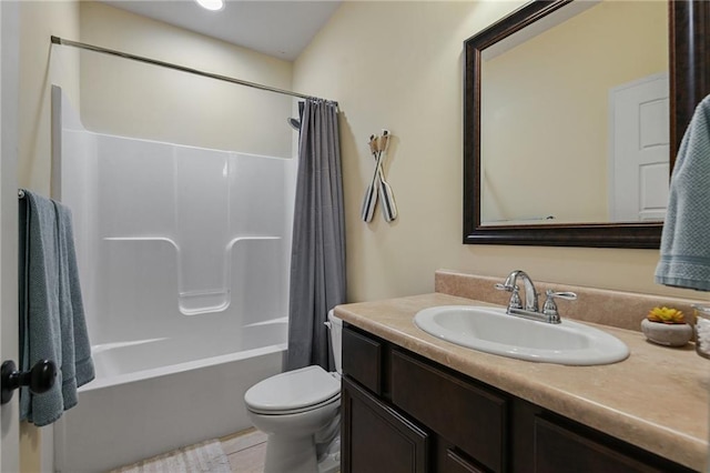 full bathroom with tile patterned floors, vanity, shower / bath combo, and toilet