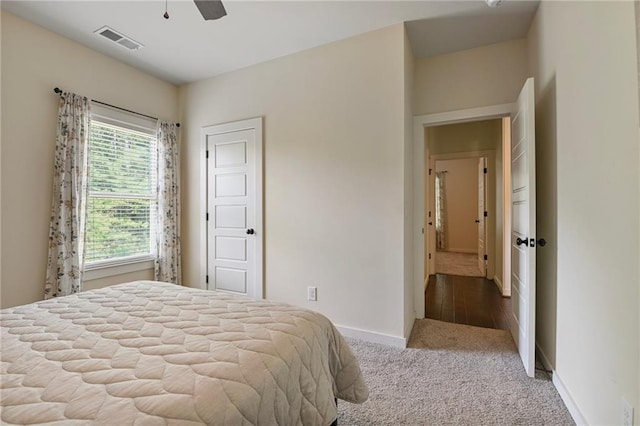 carpeted bedroom featuring ceiling fan