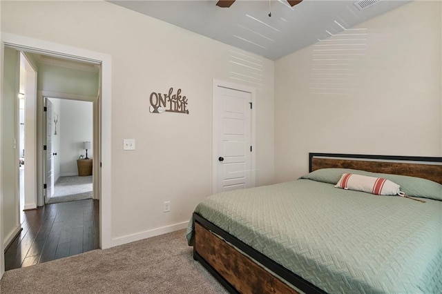 bedroom with carpet floors, lofted ceiling, and ceiling fan