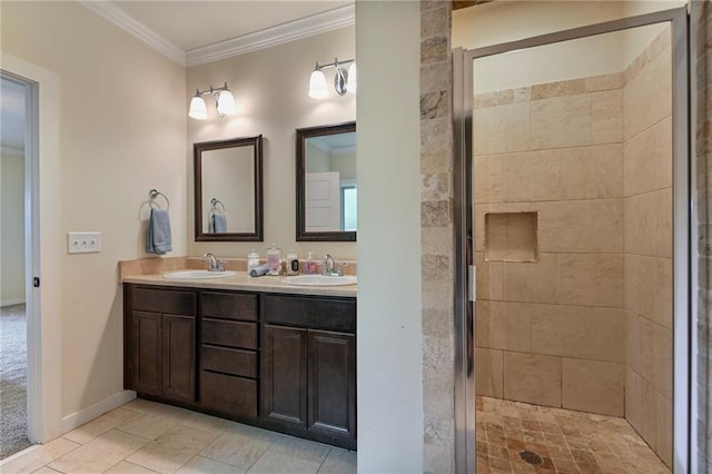 bathroom with double vanity, ornamental molding, a tile shower, and tile patterned floors