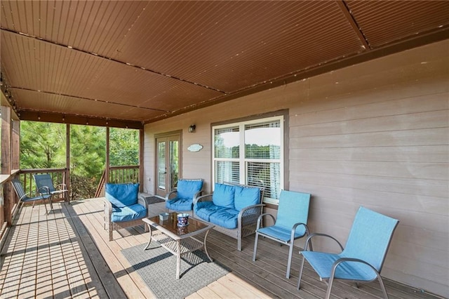 wooden deck featuring an outdoor living space