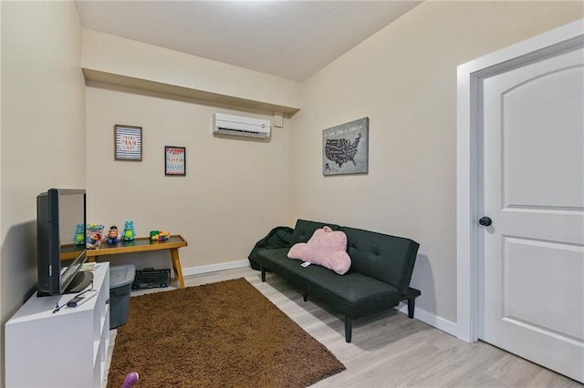 office area featuring light hardwood / wood-style floors and a wall mounted AC