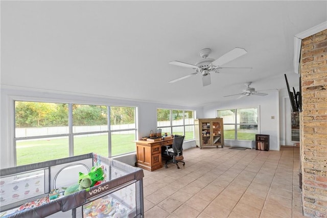 sunroom with a wealth of natural light and ceiling fan