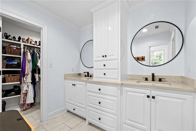 bathroom with vanity and ornamental molding