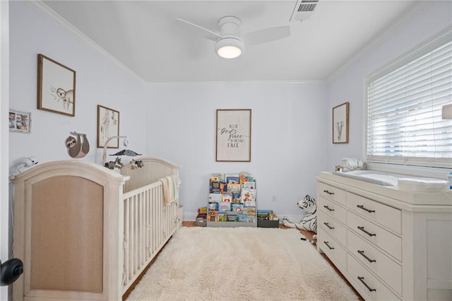 bedroom featuring ceiling fan and crown molding