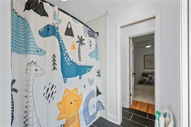 bathroom featuring tile patterned flooring and curtained shower