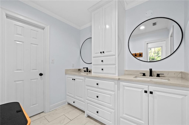 bathroom with vanity and ornamental molding