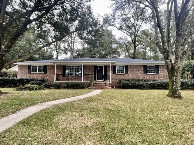 ranch-style home with brick siding and a front lawn