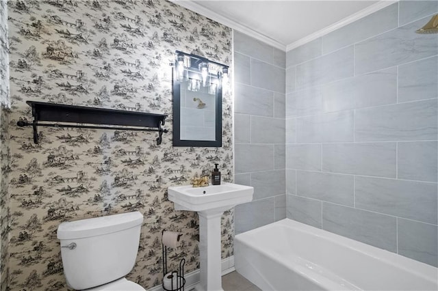 full bathroom featuring toilet, wallpapered walls, ornamental molding, and a sink