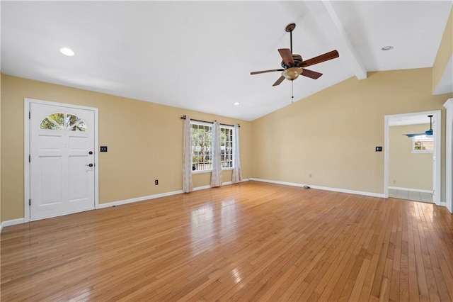 unfurnished living room with light wood-style floors, vaulted ceiling with beams, baseboards, and ceiling fan