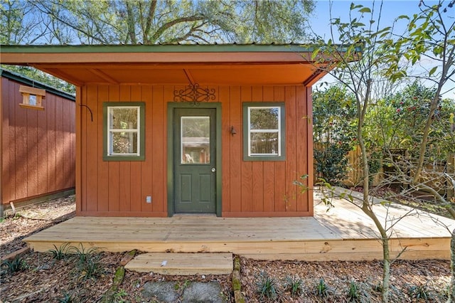 view of outbuilding with an outbuilding and fence